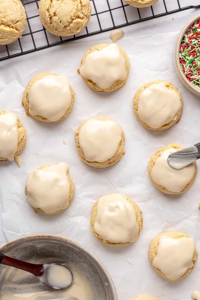 adding icing to Christmas Sugar Cookies