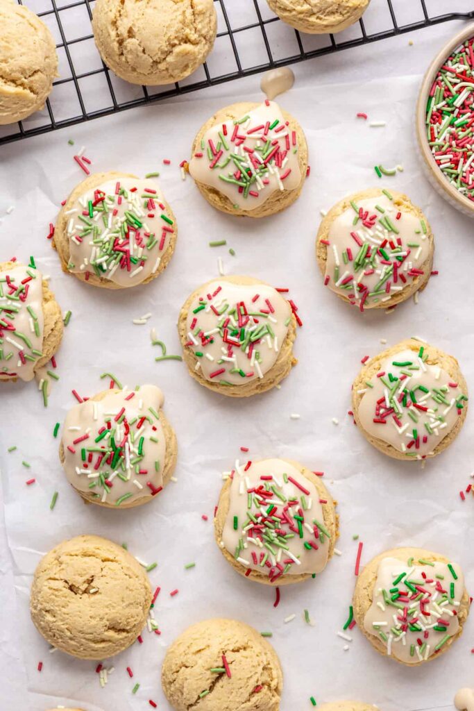 Healthy Christmas sugar cookies made with almond flour and topped with festive frosting and sprinkles