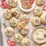 Healthy Christmas sugar cookies made with almond flour and topped with festive frosting and sprinkles