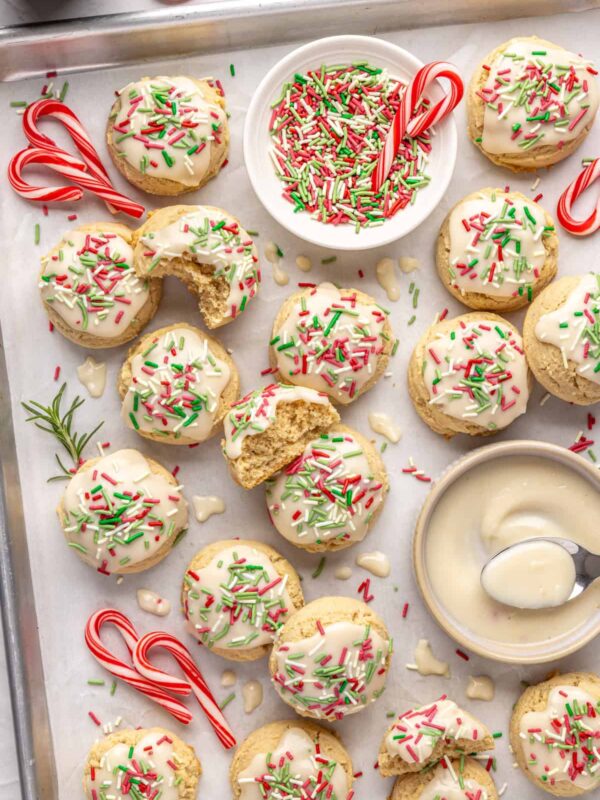 Healthy Christmas sugar cookies made with almond flour and topped with festive frosting and sprinkles