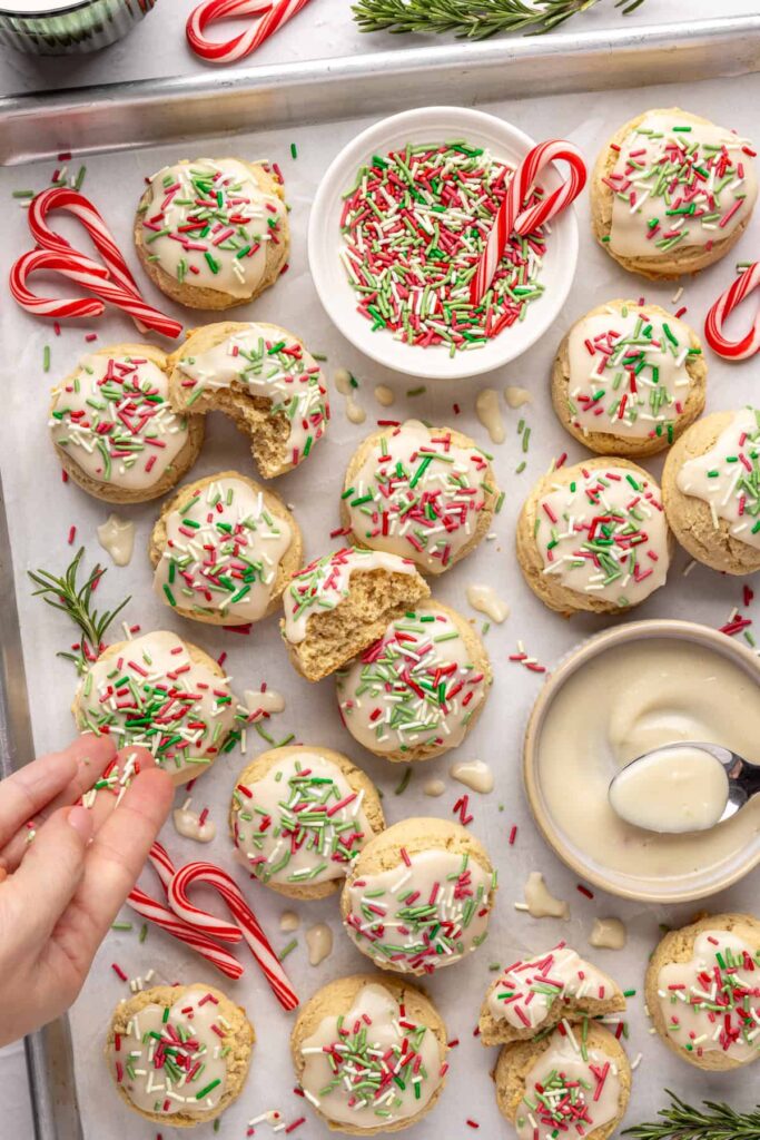 Healthy Christmas sugar cookies made with almond flour and topped with festive frosting and sprinkles