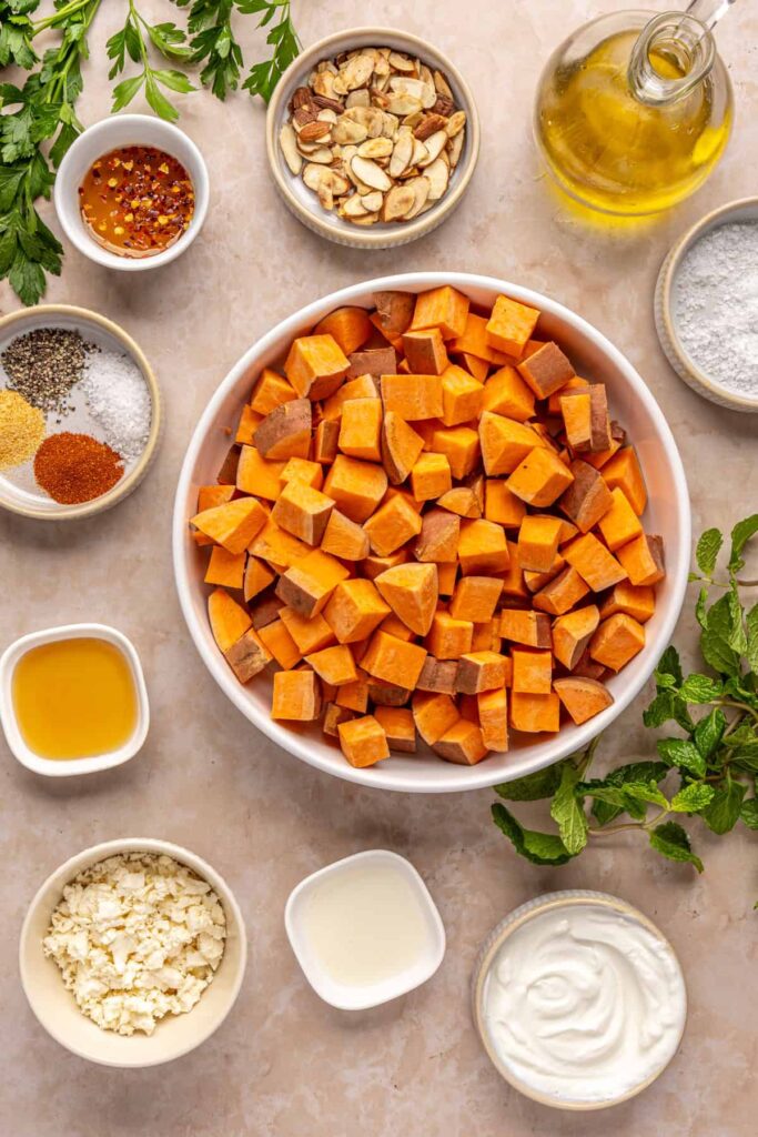 Overhead shot of ingredients for roasted sweet potatoes with whipped feta and hot honey
