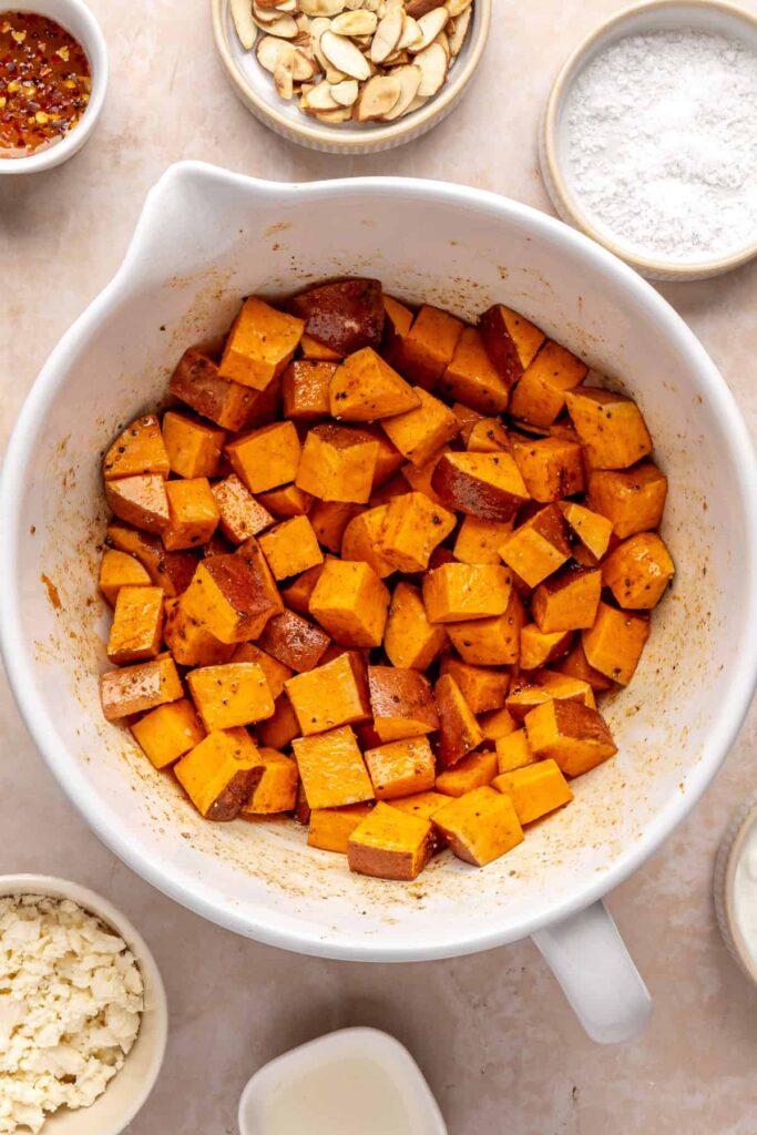 sweet potato cubes in a bowl before roasting