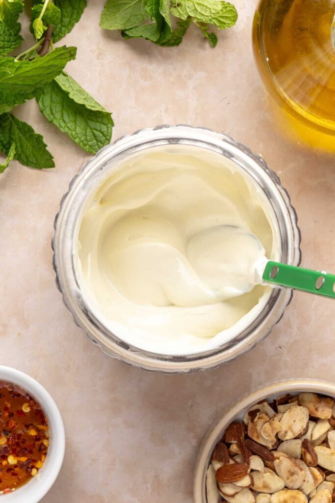 Smooth and creamy whipped feta ready to top roasted sweet potatoes