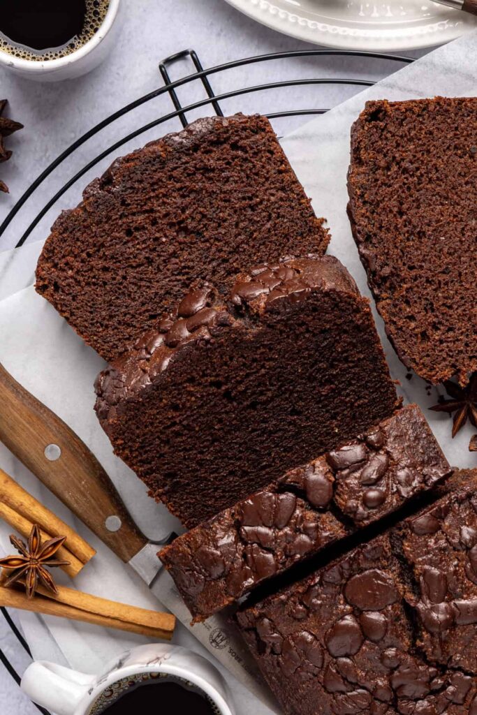Overhead shot of pumpkin spice chocolate loaf sliced into even pieces, grain-free and dairy-free.