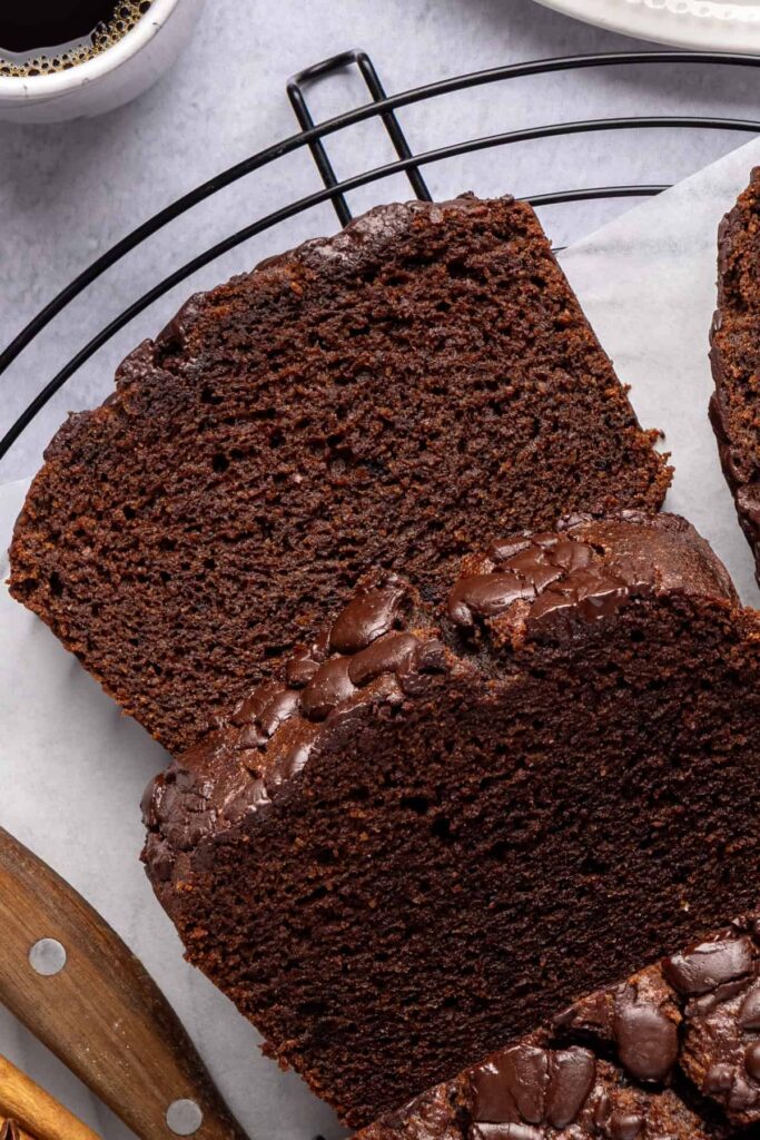 Overhead shot of pumpkin spice chocolate loaf sliced into even pieces, grain-free and dairy-free.