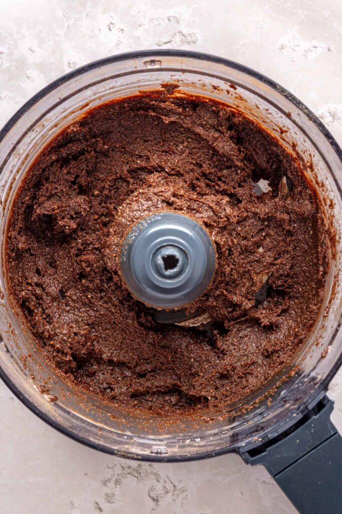 Brownie bite mixture blended into a sticky dough before rolling into balls
