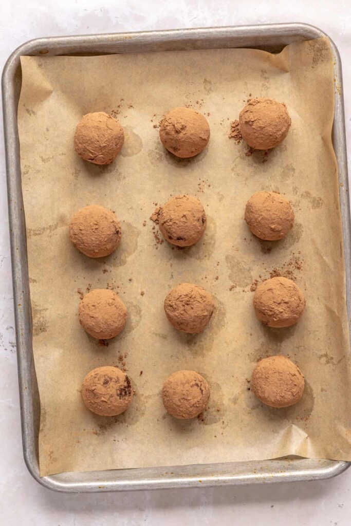 Tray of rolled brownie bites ready to be chilled in the fridge