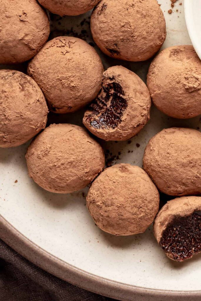 protein brownie bites styled on a white plate