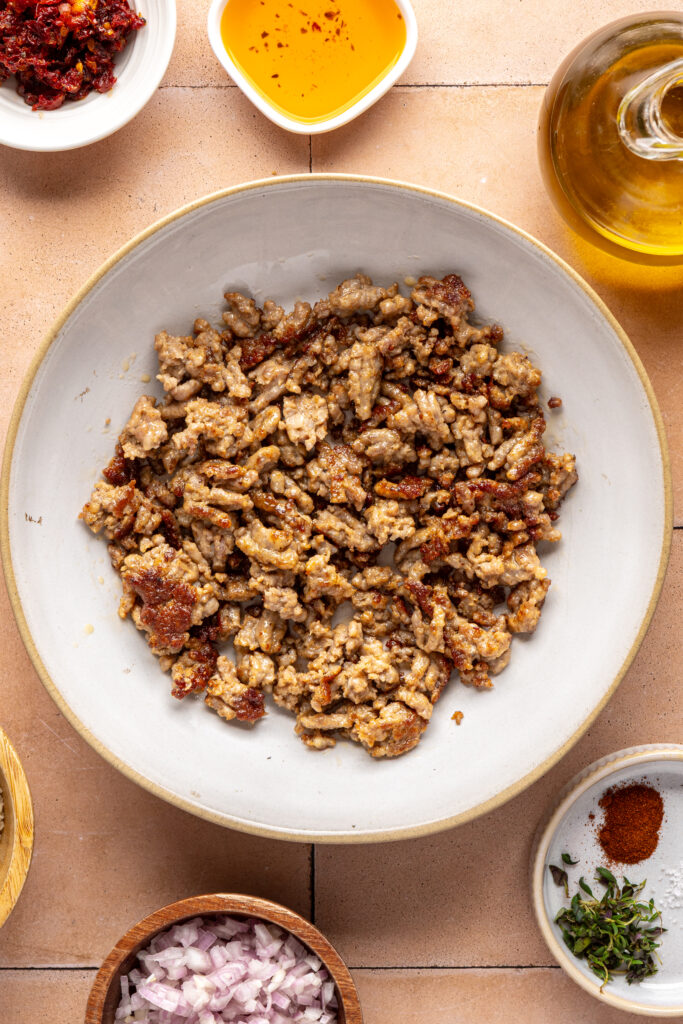Cooked meat for holiday stuffed mushrooms with goat cheese