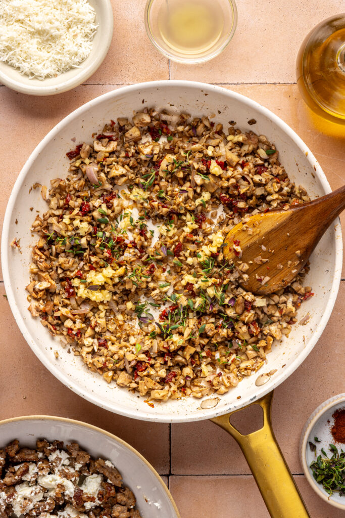 Mixing ingredients for mushroom stuffed with goat cheese