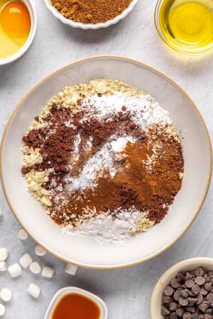 Dry ingredients for hot cocoa cookies in a medium mixing bowl