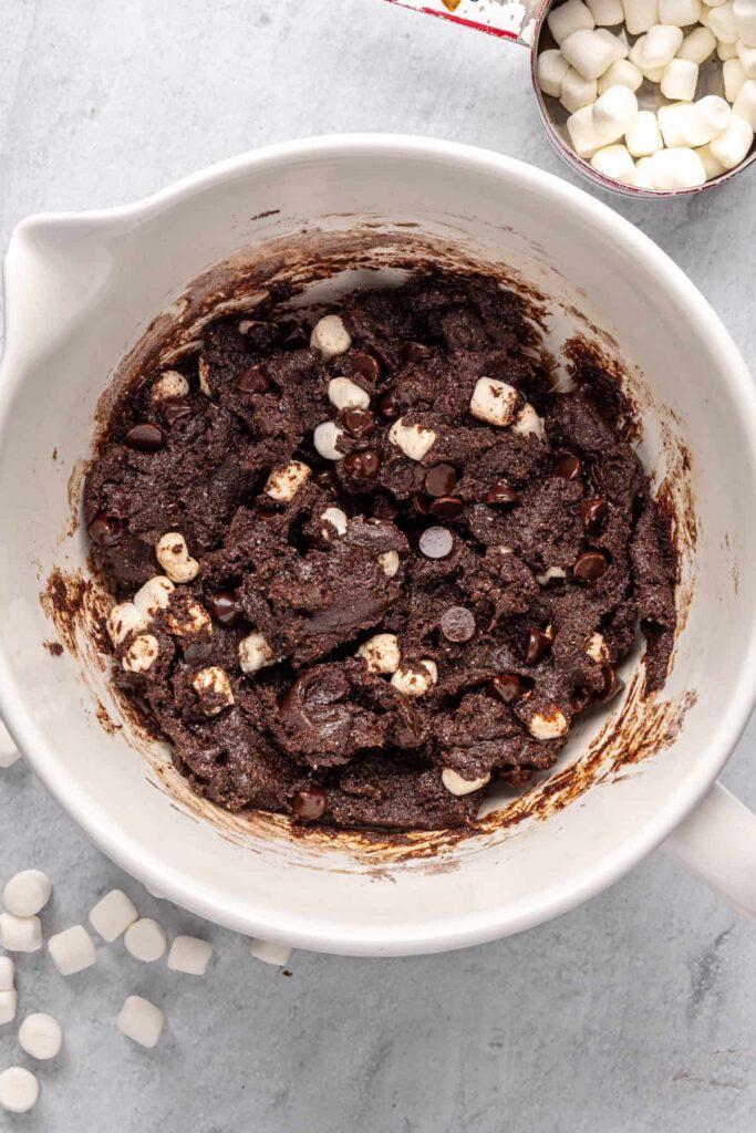 Chocolate chips and marshmallows evenly incorporated in hot cocoa cookie dough