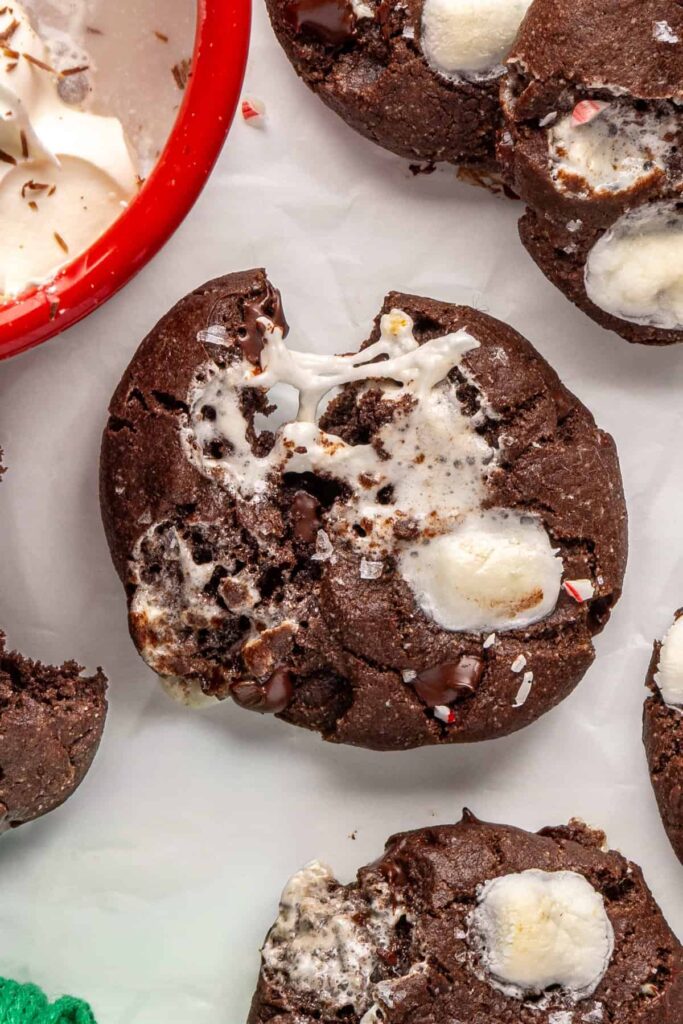 Close-up of warm hot cocoa cookies topped with melted marshmallows and chocolate chips