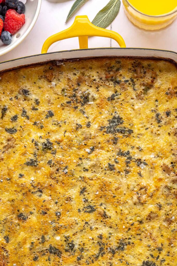 close-up of Baked Chicken & Veggie Egg Bake with maple sage chicken and veggies in a 9x13 dish