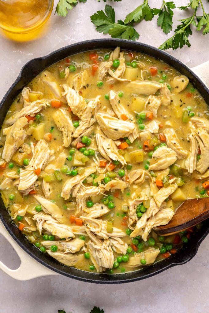 Shredded chicken and peas stirred back into skillet pot pie mixture