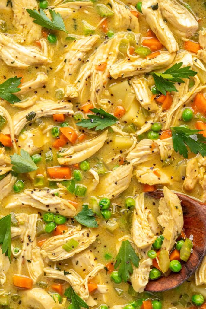 close up of Chicken pot pie simmering in skillet as flavors meld before serving.