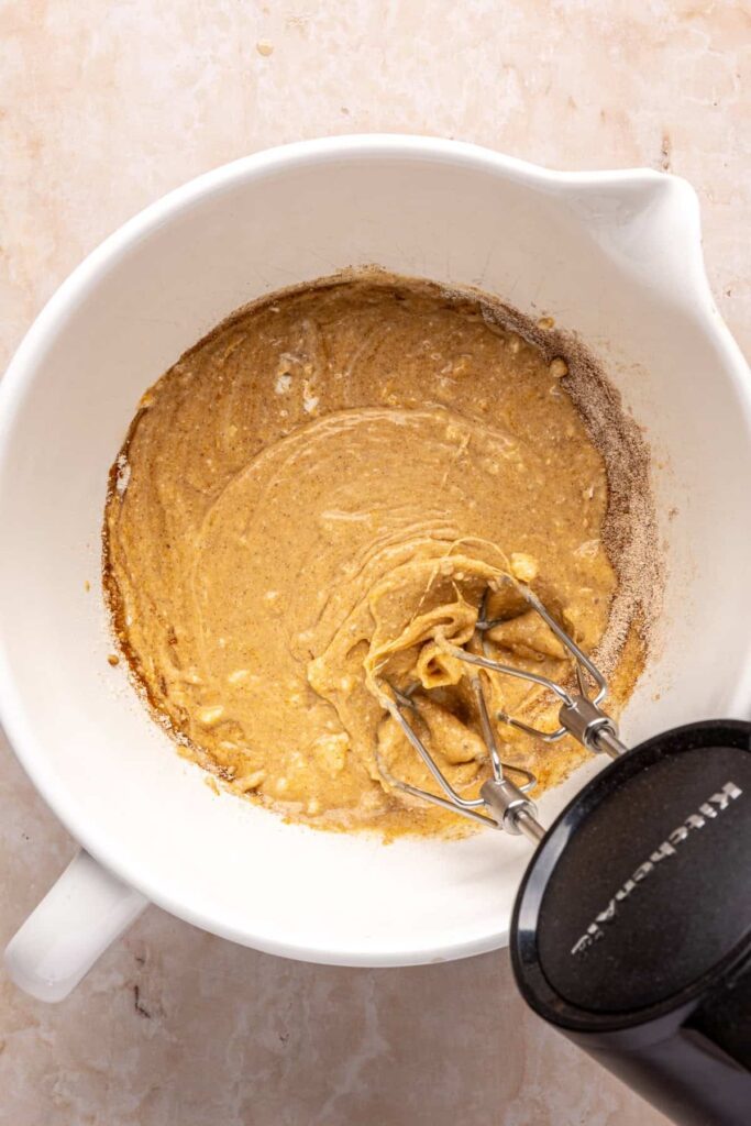 Using a frother to make airy pumpkin cold foam for iced coffee
