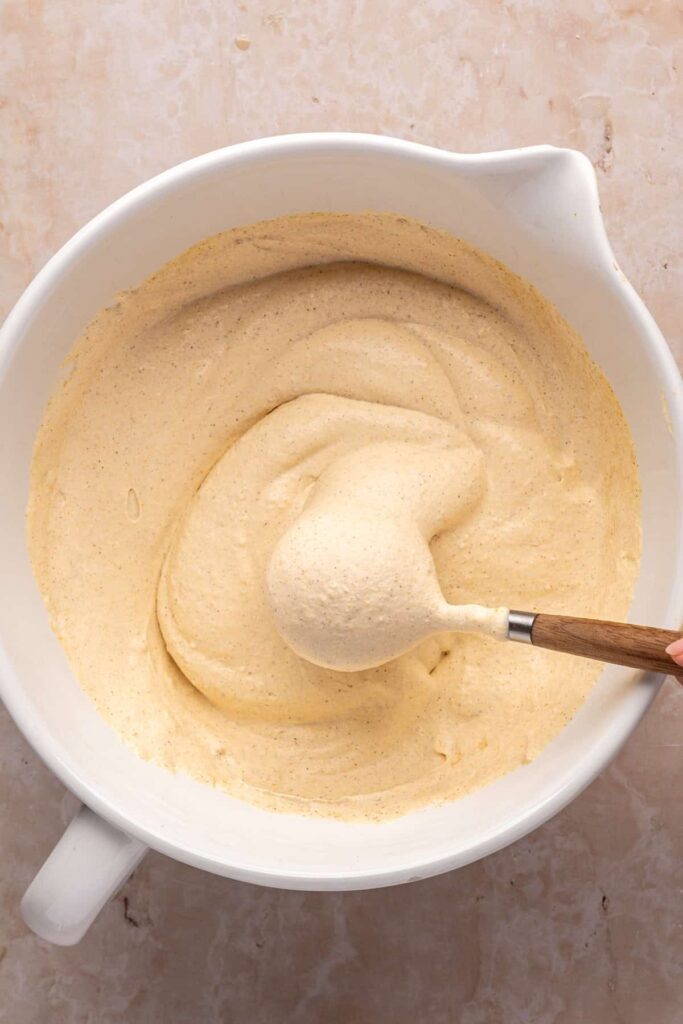 Homemade pumpkin cold foam in a bowl ready to top iced coffee