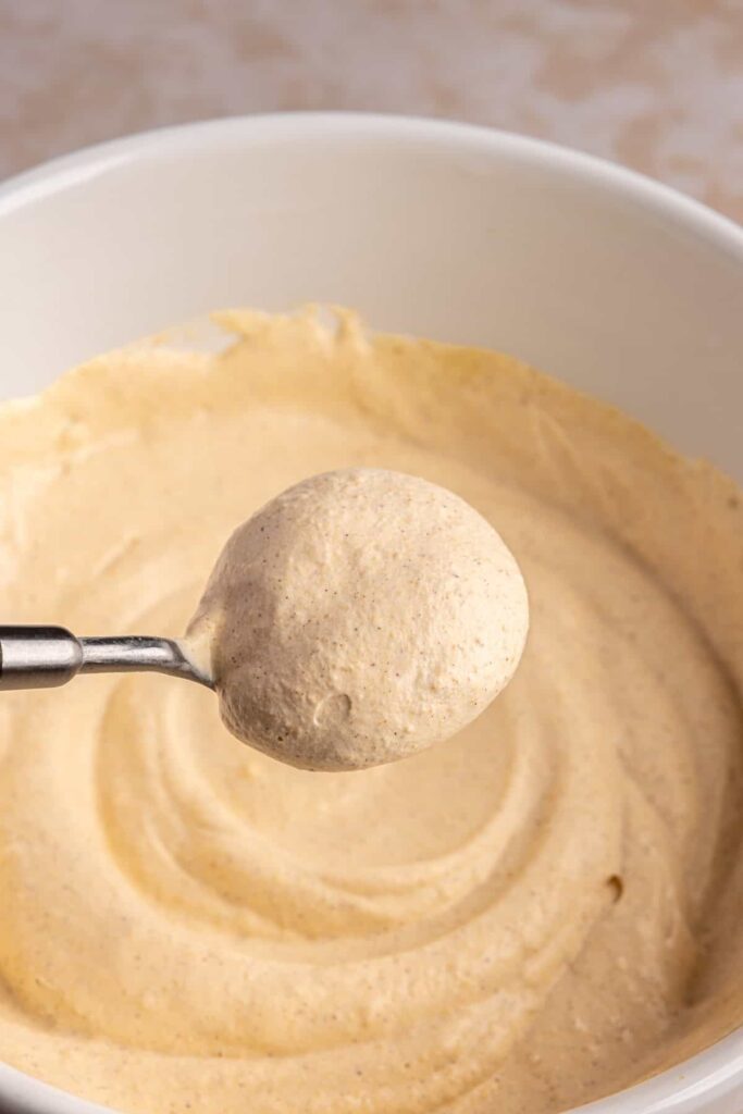 Homemade pumpkin cold foam in a bowl ready to top iced coffee