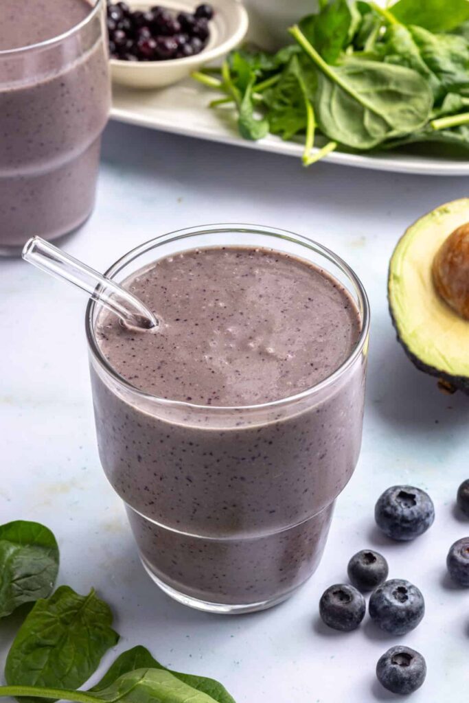 Toddler smoothie served in a glass with a reusable glass straw