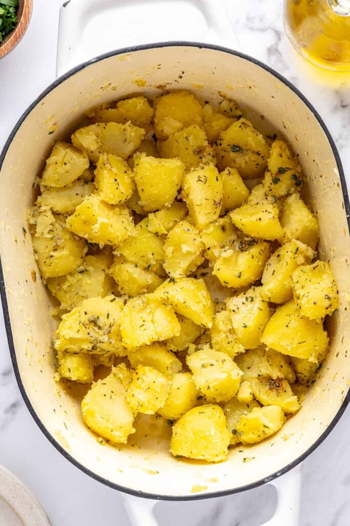Boiled potatoes seasoned with olive oil, thyme, garlic powder, and black pepper