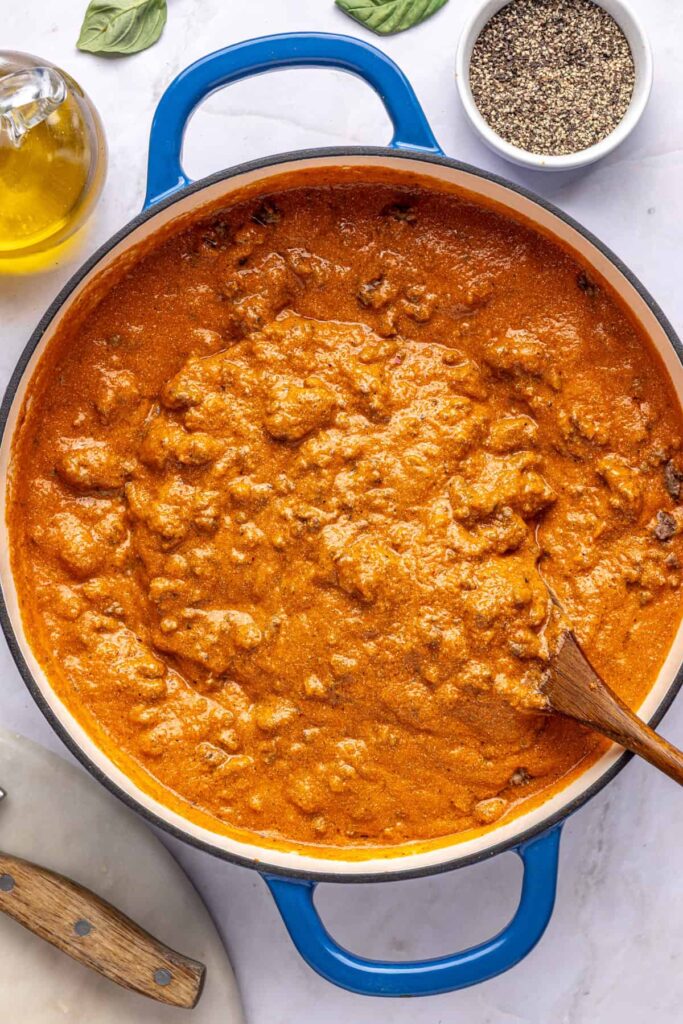 Cooked ground meat stirred into creamy vodka sauce with hidden vegetables