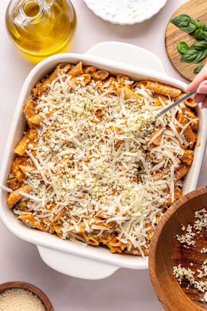 Panko and parmesan sprinkled over baked ziti before going in the oven