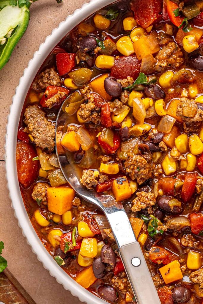 Close-up of chipotle beef & black bean soup with sweet potatoes and black beans