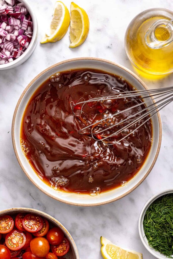 Flank steak seasoned with Greek spice blend before slow cooking