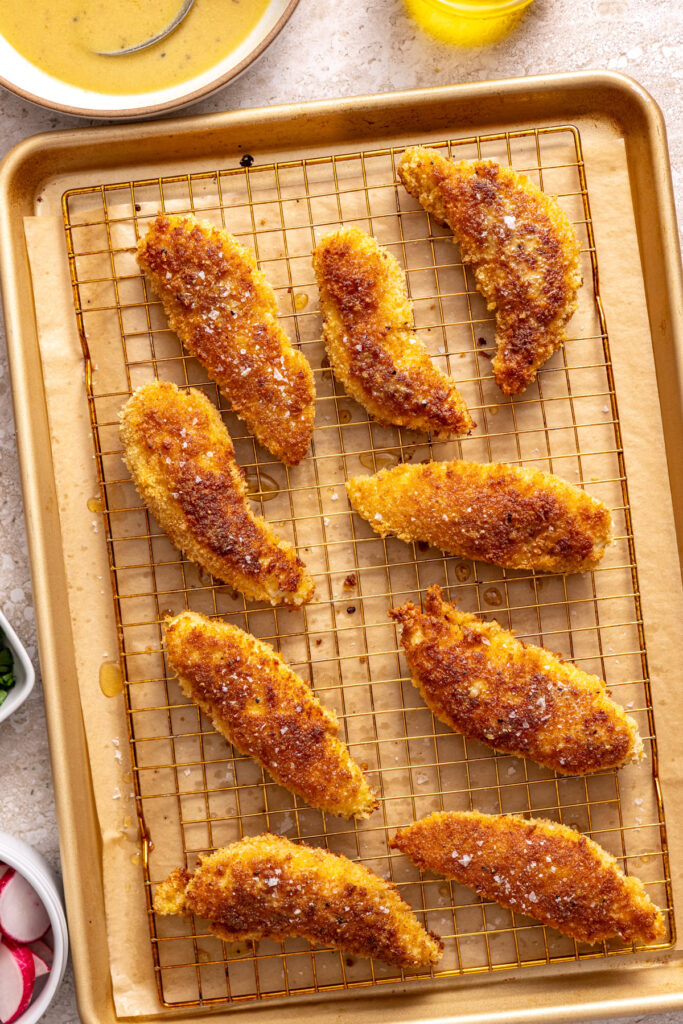 crispy chicken tenders brushed with homemade honey mustard dressing for chicken kale salad