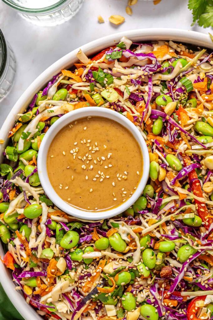 Close-up of crunchy peanut cabbage salad with shredded cabbage, carrots, and peanuts