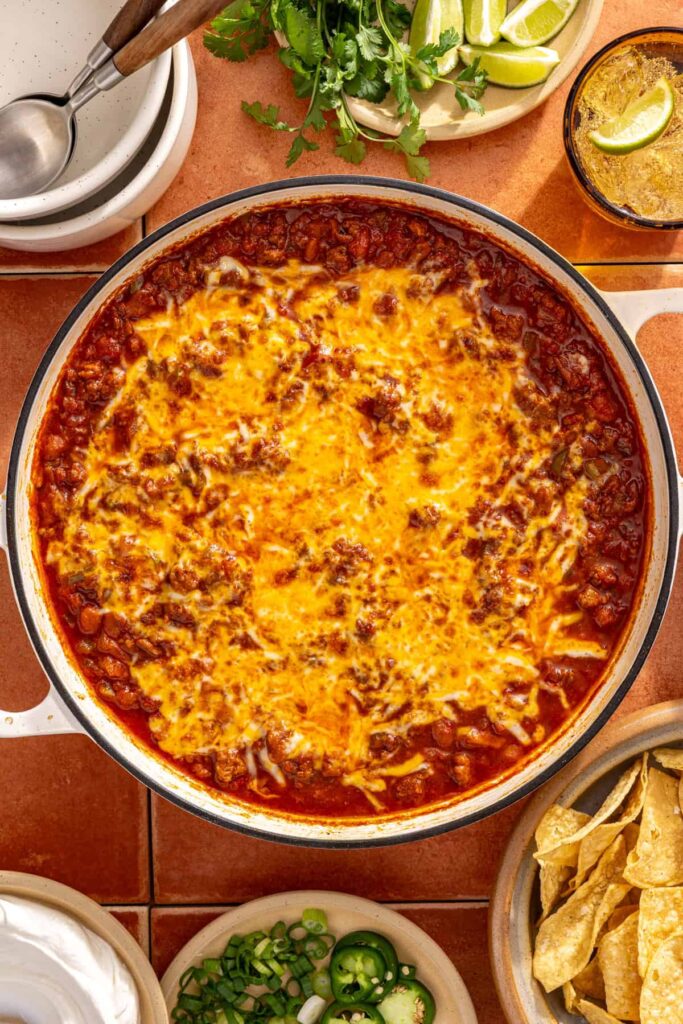 Melted cheese on top of cheesy chili skillet