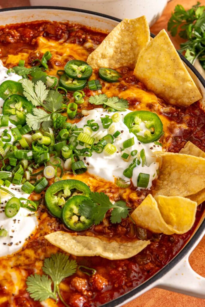 Cheesy chili skillet served as dip with tortilla chips