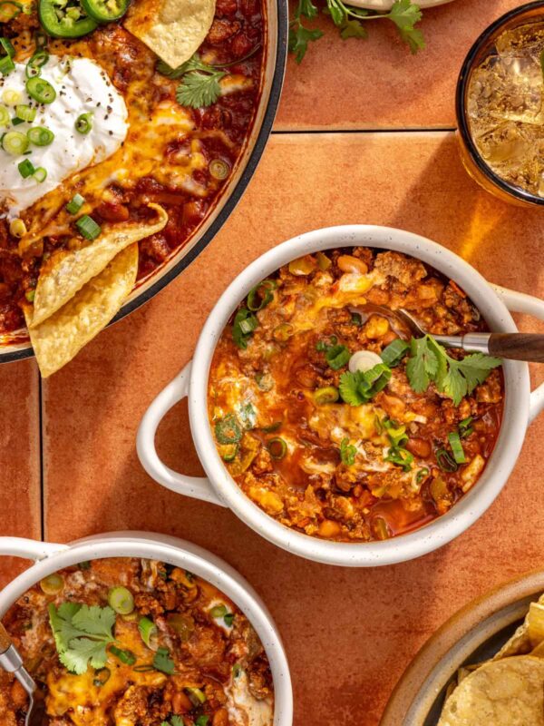 Bowl of high-protein chili skillet with Greek yogurt and herbs
