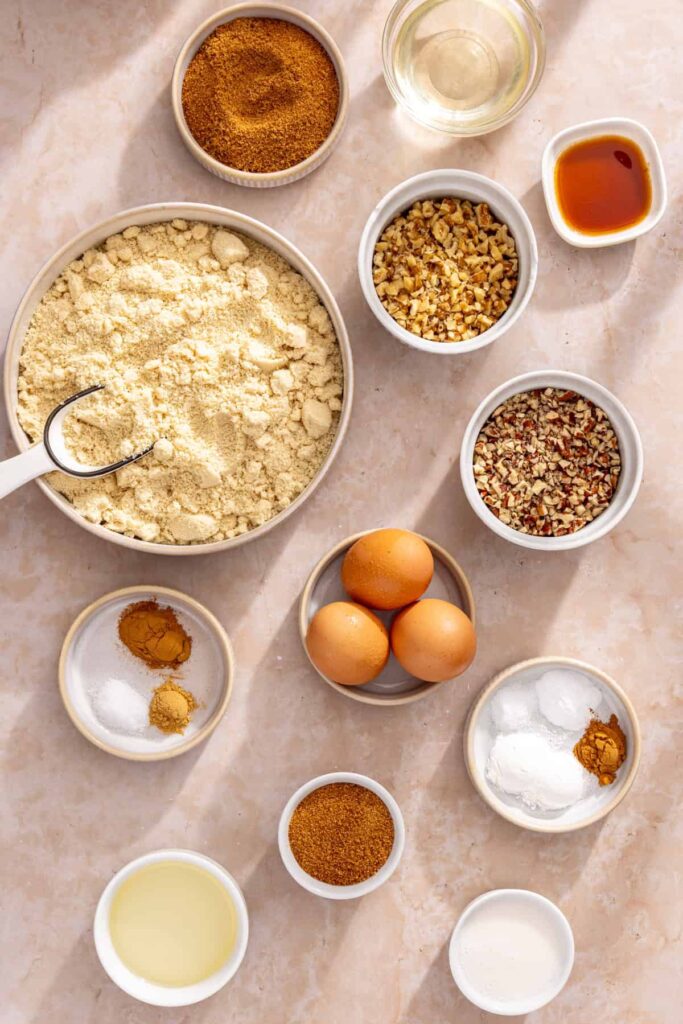 Overhead shot of ingredients needed to make gluten-free coffee cake muffins with almond flour and coconut sugar