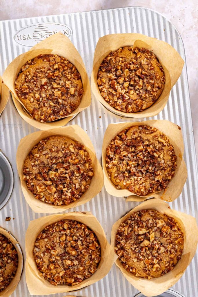 Overhead view of gluten-free coffee cake muffins cooling after baking
