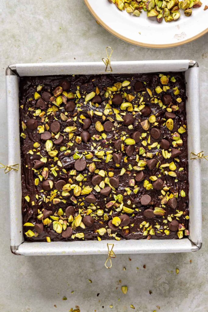 Gluten-free pistachio brownies ready to bake in square pan