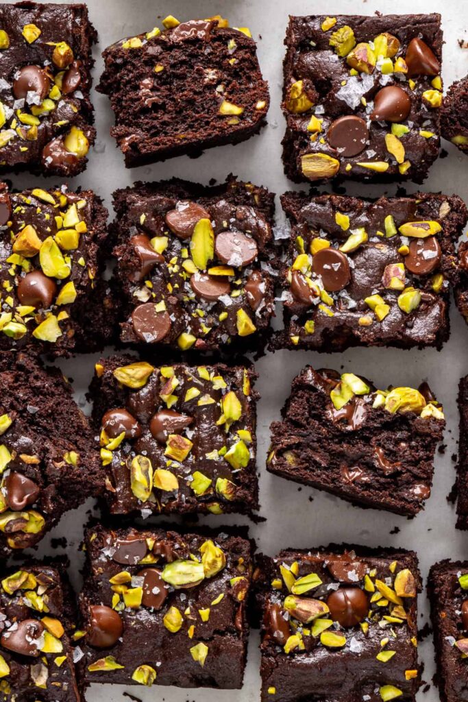 Close up pistachio brownie showing fudgy center and crisp top