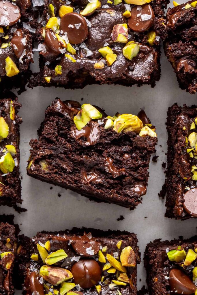 Fudgy gluten-free pistachio brownies with soft chocolate interior
