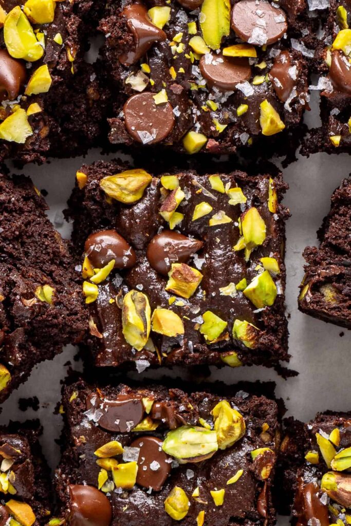 Fudgy gluten-free pistachio brownies with soft chocolate interior