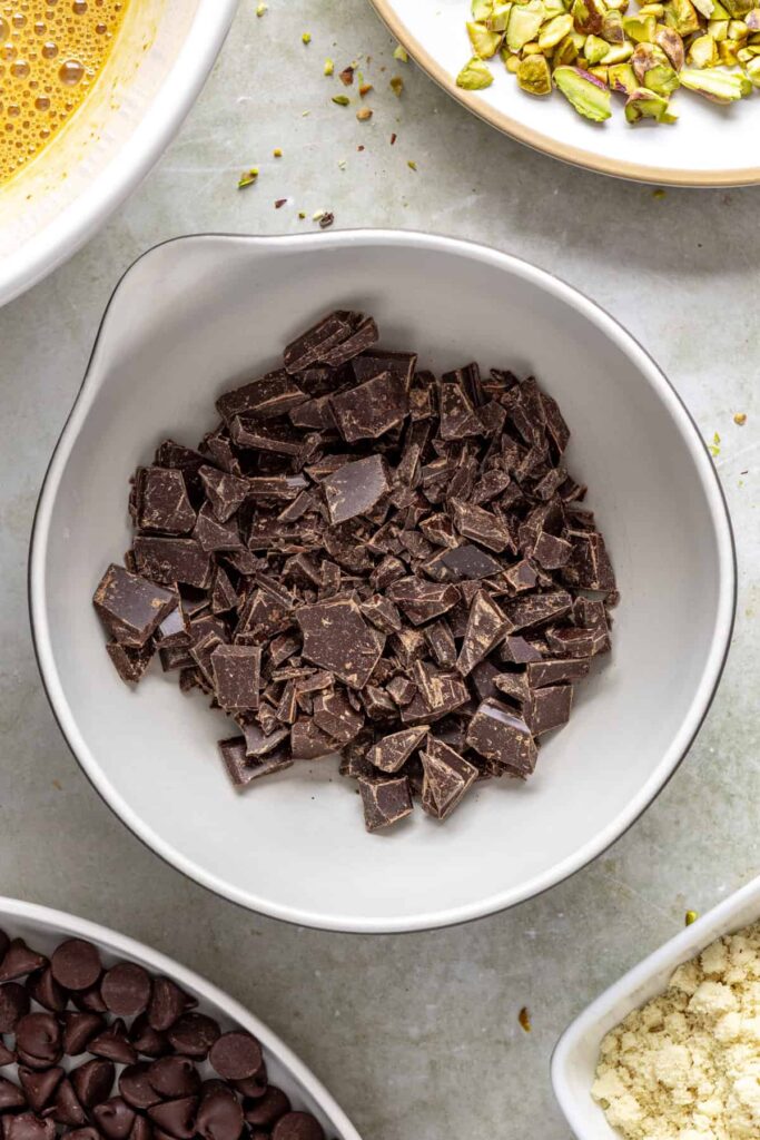 chopped dark chocolate in microwave-safe bowl, ready to be melted
