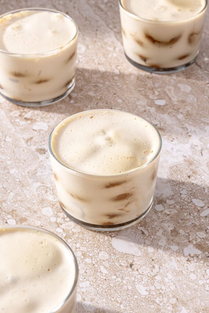 No-bake tiramisu cups fully layered and set after refrigeration