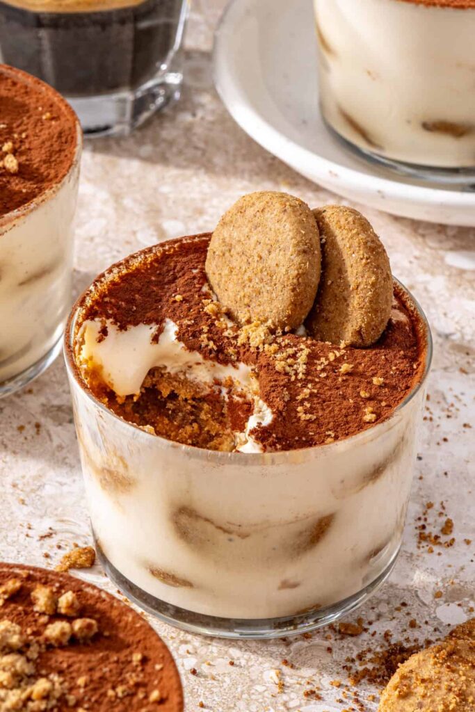 Gluten-free tiramisu cups styled with espresso and cookies