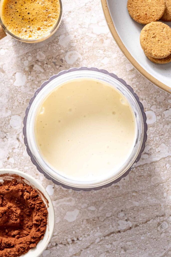 Starting the creamy filling for healthy tiramisu cups in a high-speed blender