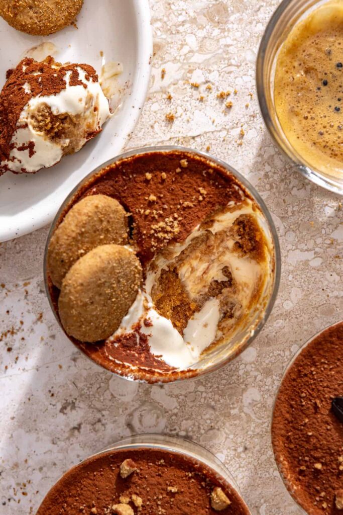 Overhead view of high-protein tiramisu cups ready to serve