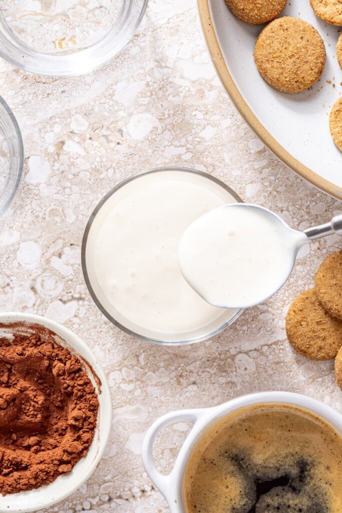 First layer of cottage cheese tiramisu cream being added