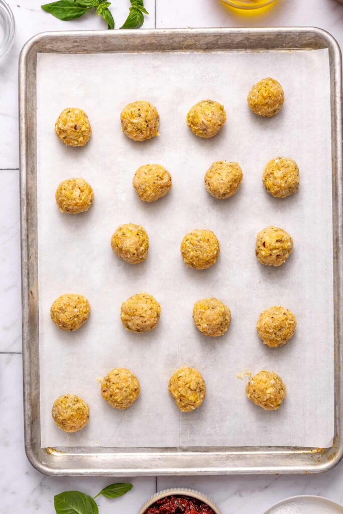 marry me chicken meatballs on baking pan before transferring to skillet
