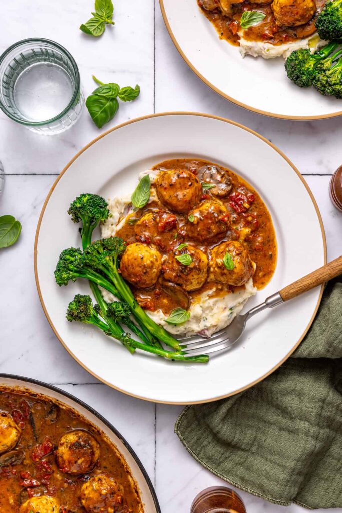 One-pan chicken meatballs plated for dinner with multiple servings