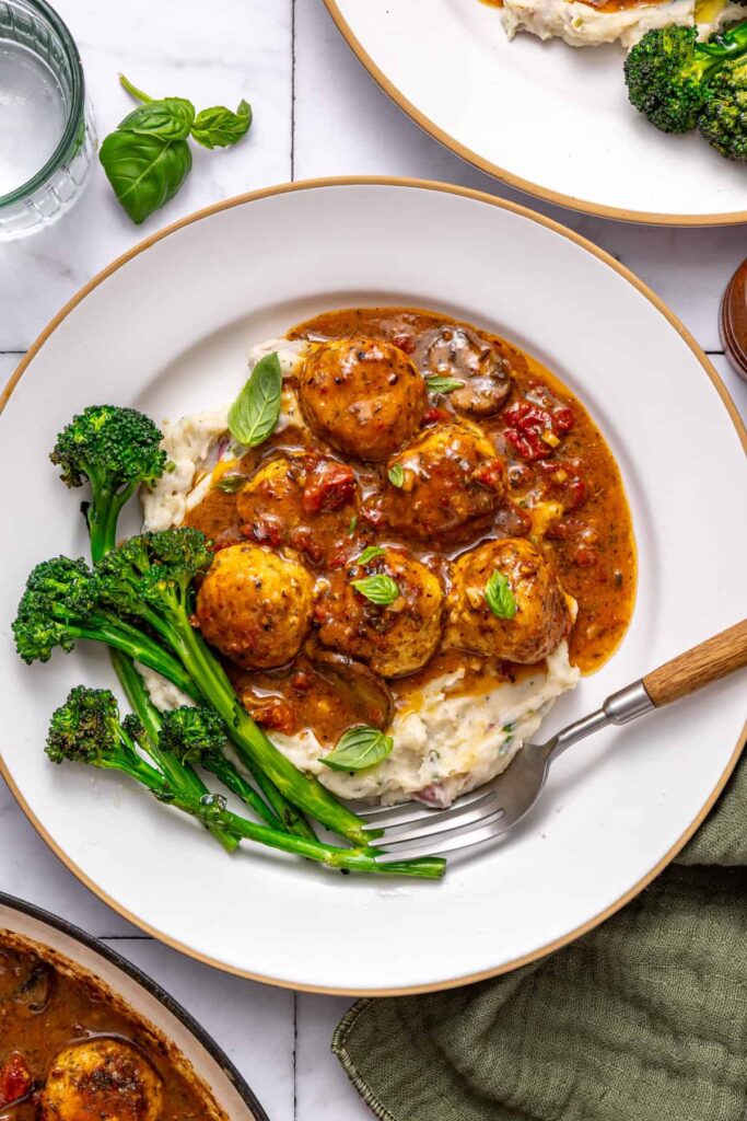 Cozy dinner table with creamy chicken meatballs meal